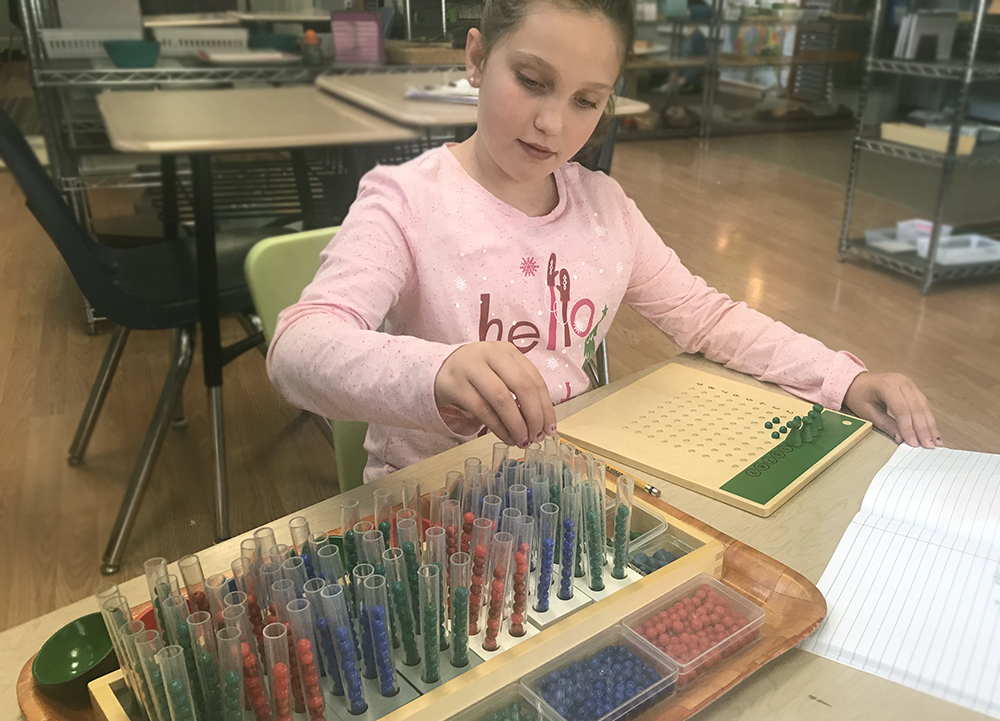 Image of student enjoying a lesson at a Yadkin Valley Montessori school