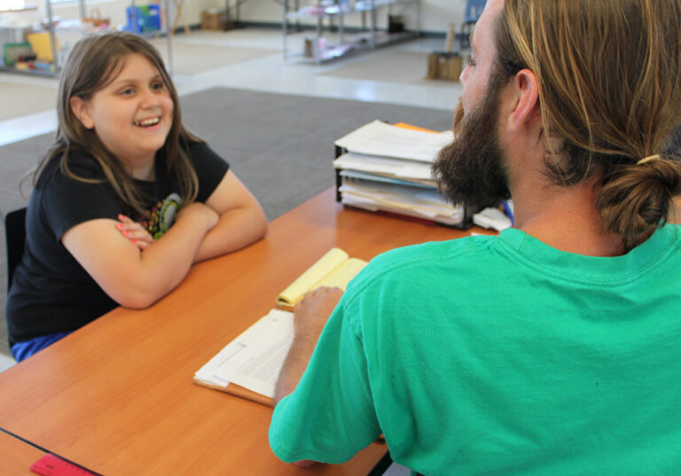 Image of happy student and teacher at a Yadkin Valley Montessori school